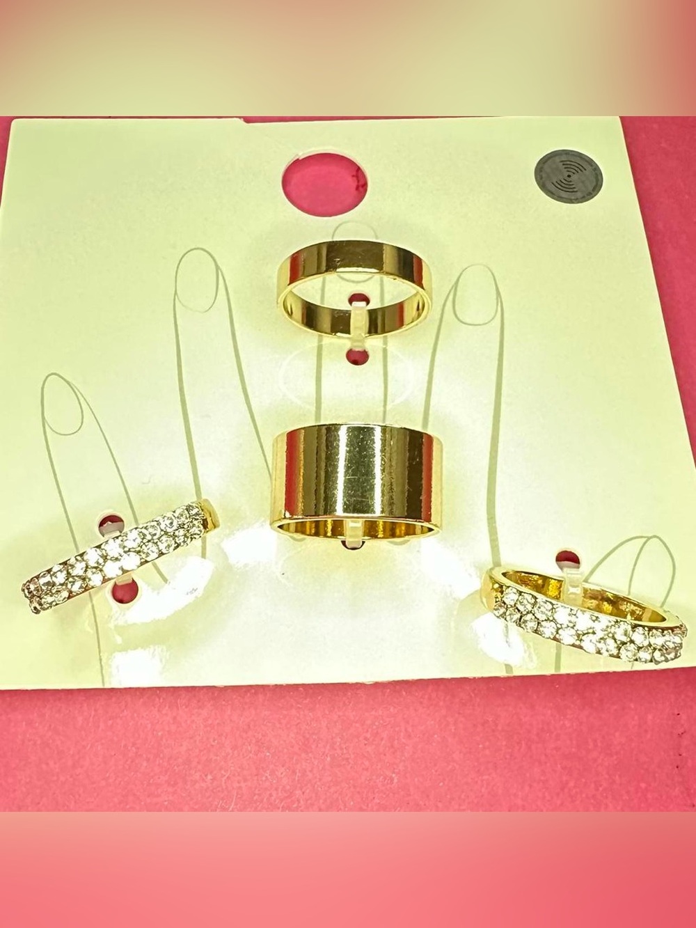 Four size 7 golden tone rhinestone ring set.